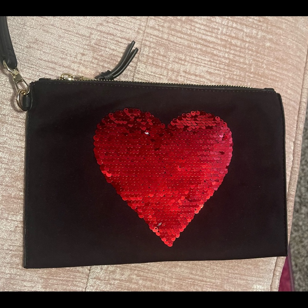 Brand new large black wristlet with sequin heart purchased from Macys